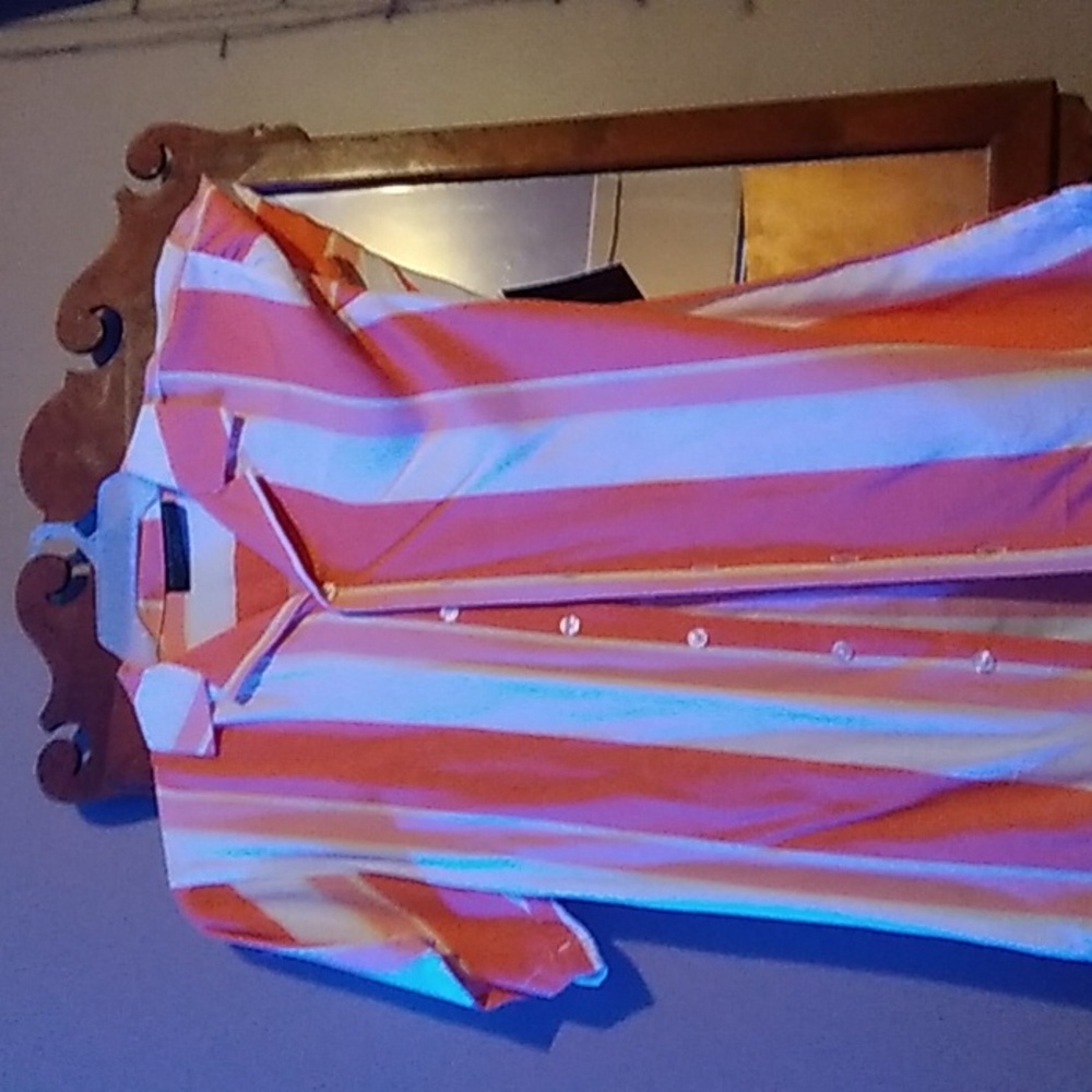 A brand new button up peach and white shirt.